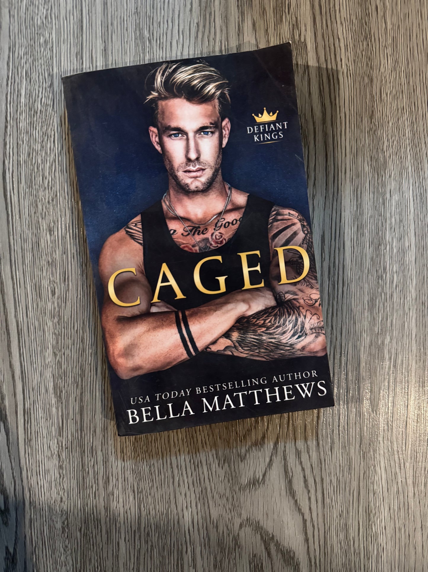 Caged (Defiant Kings #1) by Bella Matthews-Used