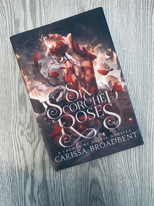 Six Scorched Roses (Crowns of Nyaxia #1.5) by Carissa Broadbent - Hardcover Used