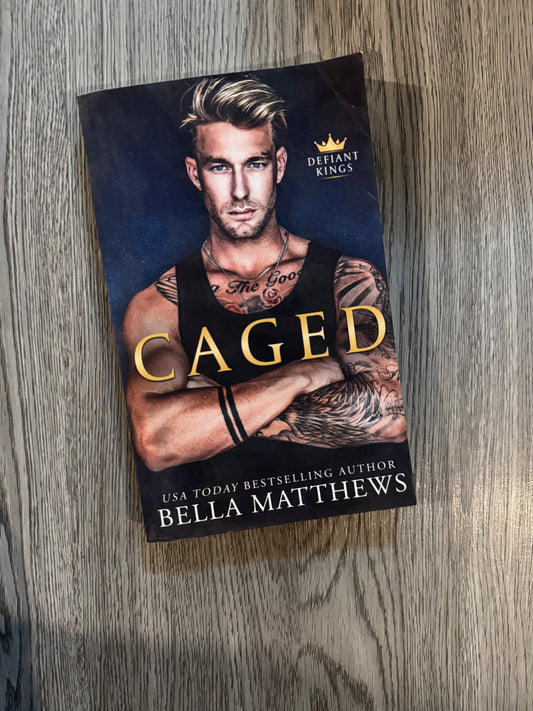 Caged (Defiant Kings #1) by Bella Matthews-Used