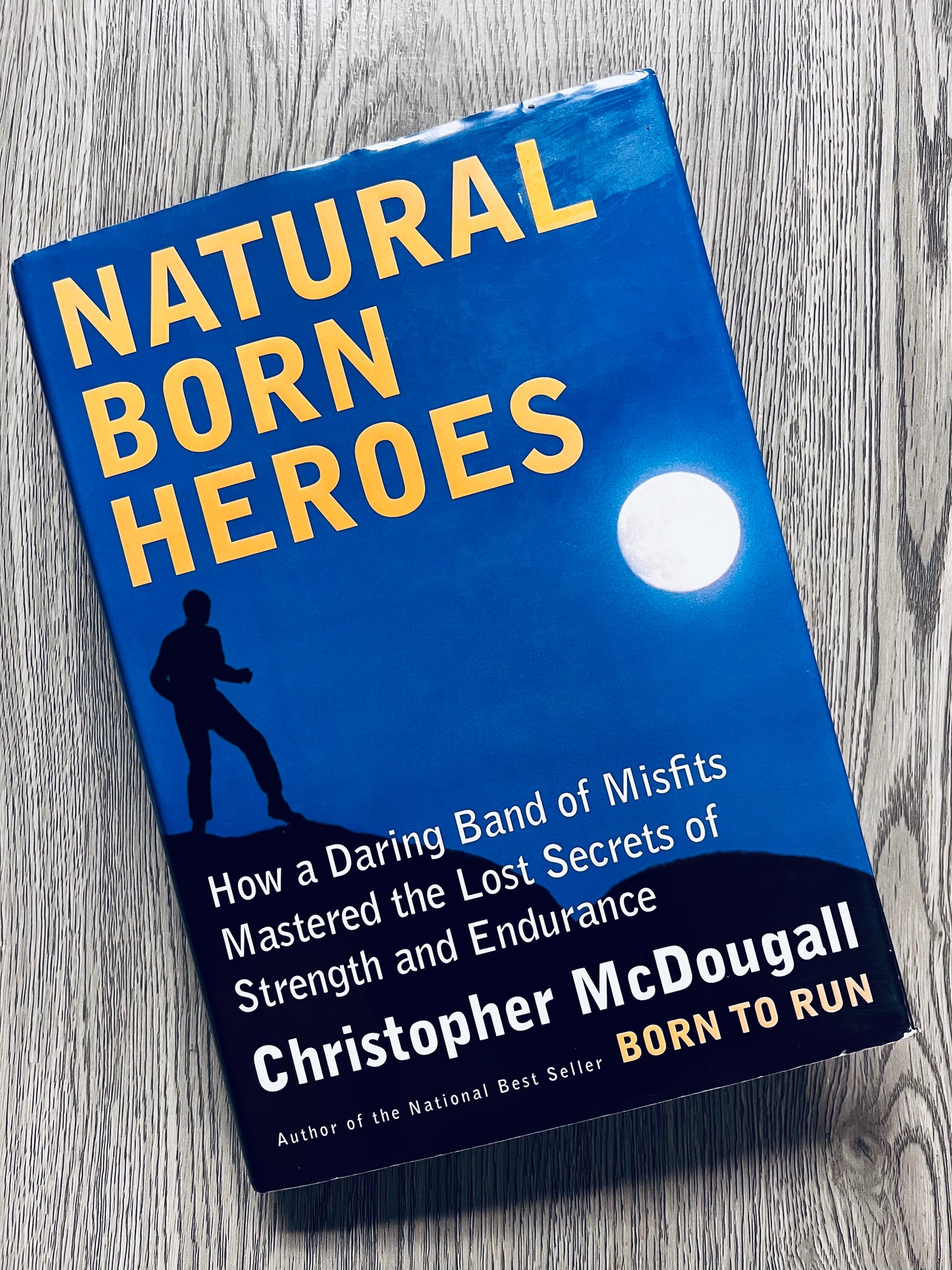 Natural Born Heroes: How a Daring Band of Misfits Mastered the Lost Secrets of Strength and Endurance by Christopher McDougall - Hardcover