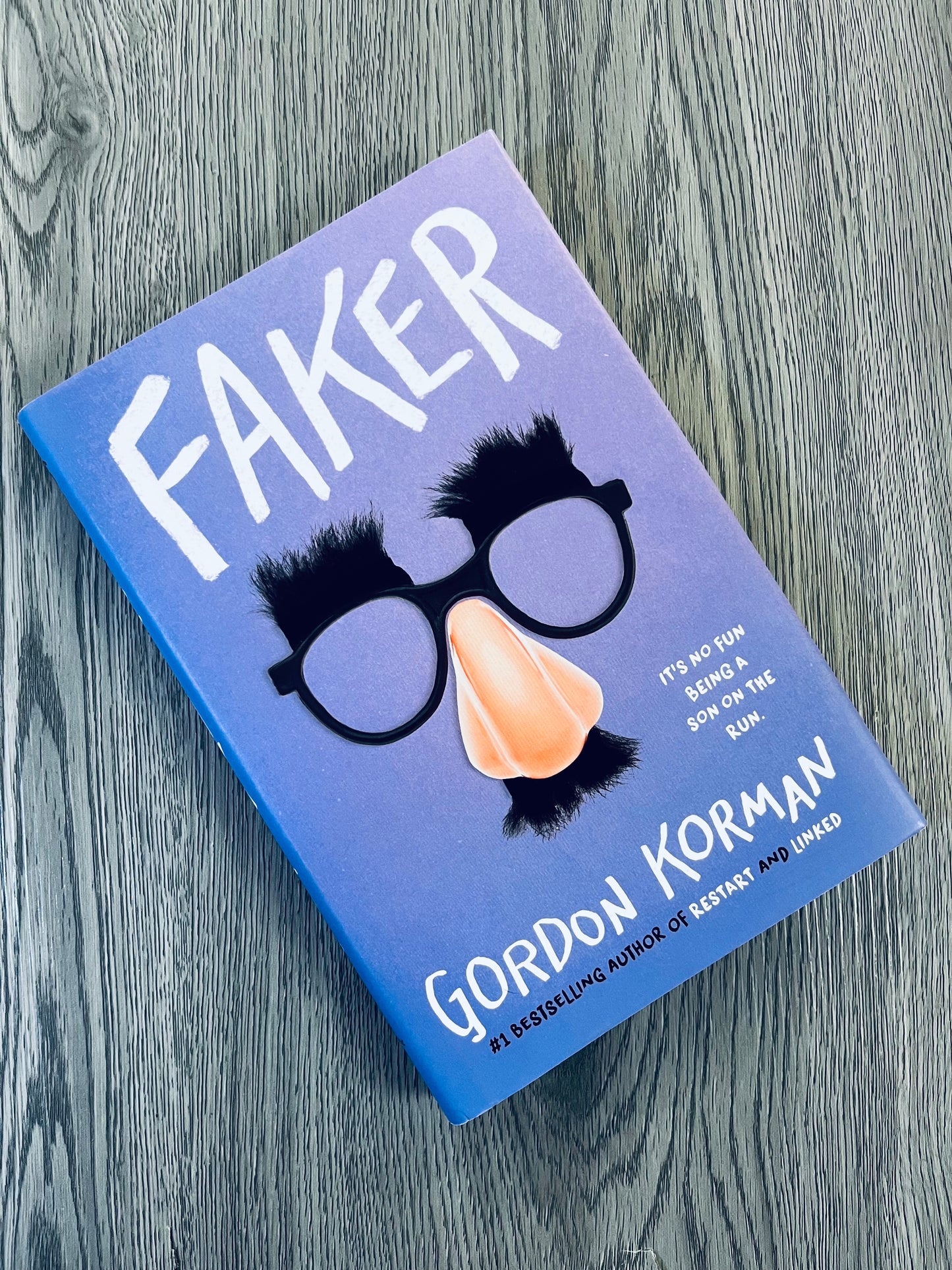 Faker by Gordon Korman - Hardcover Used